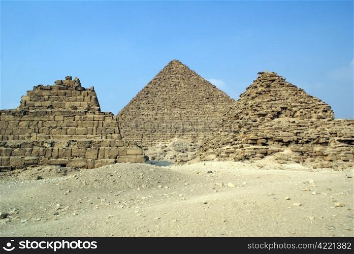 Three piramids and desert in Giza, Egypt