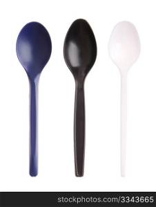 three plastic spoons (blue, black and white) isolated on white background