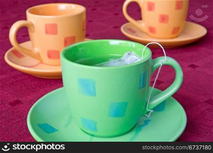 three pots of tea on the table