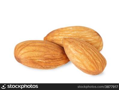 Three raw almonds isolated on a white background