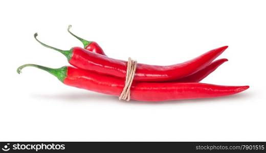Three red chili peppers tied with a rope isolated on white background
