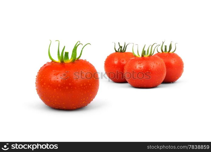 Three red tomatos isolated on white background