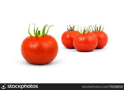 Three red tomatos isolated on white background