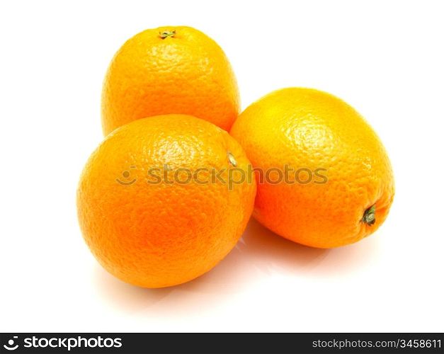 Three ripe oranges lie nearby on a white background