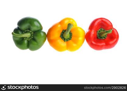 three ripe peppers lies on surface