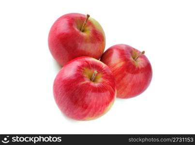 three ripe red apple on white background