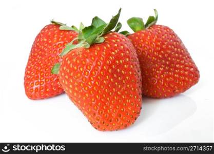 three ripe strawberries isolated on white background