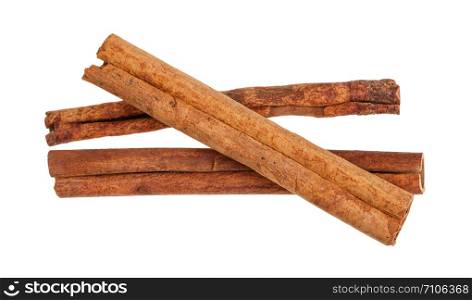 three rolled dried Cinnamon sticks isolated on white background