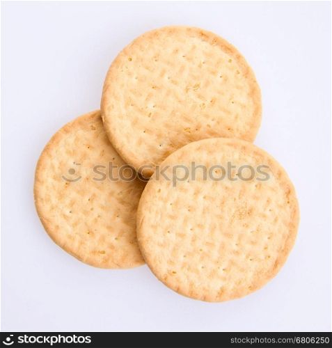 Three round biscuits on a grey background