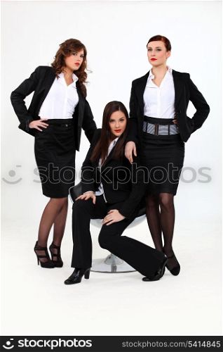 Three seductive businesswomen