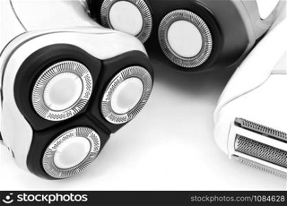 Three shavers close-up. Black and white style.