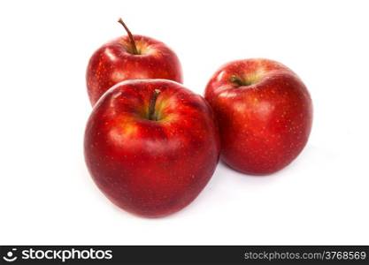 Three shiny red apples isolated on a white background