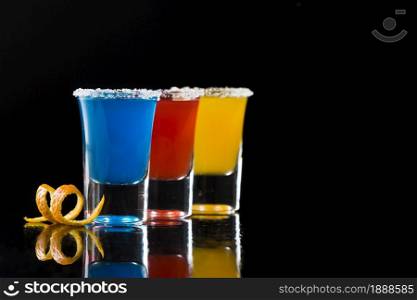 three shot glasses with cocktails coy space. Resolution and high quality beautiful photo. three shot glasses with cocktails coy space. High quality and resolution beautiful photo concept
