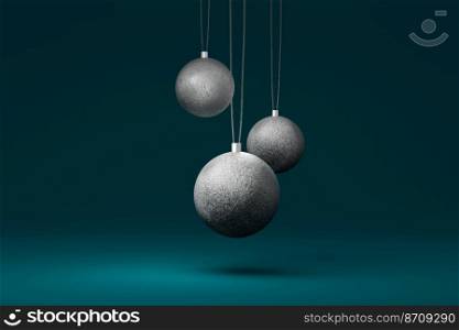 Three silver Christmas tree bauble isolated on a blue background. 3d illustration