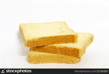 three slices of toasted bread one on top of the other on a white background