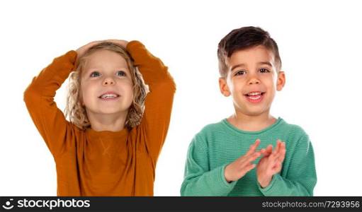 Three small children covering their mouths isolated on a white background