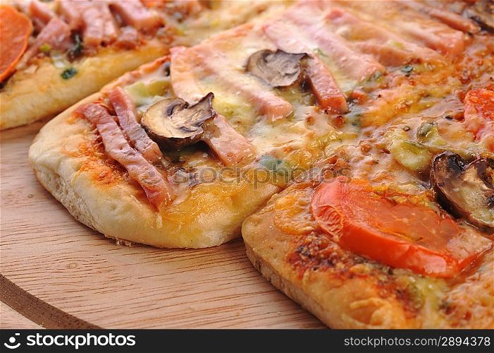 three small pizzas close up