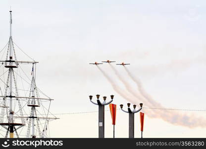 three small planes in cloudy sky