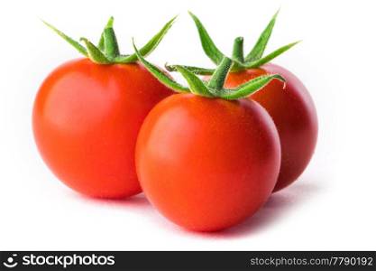 Three small ripe red tomatoes isolated on white background. Three small red tomatoes