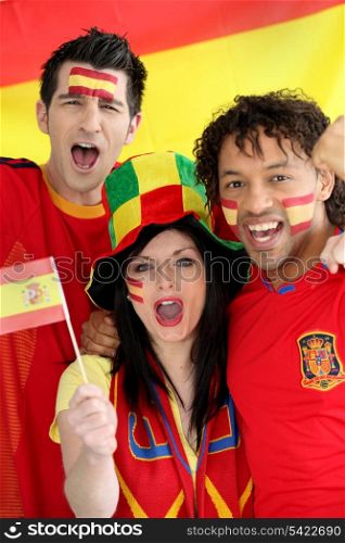 Three Spanish football fans