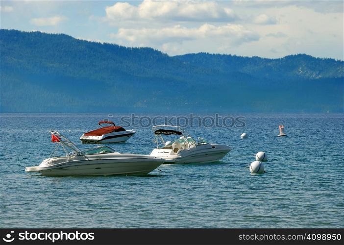 Three speedboats on lake Tahoe in California