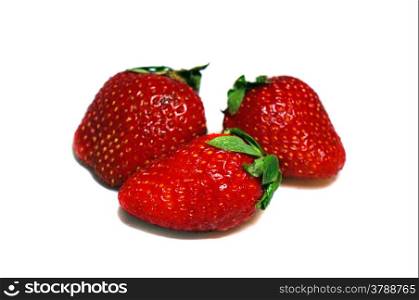 Three strawberries isolated on white background