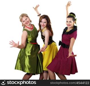 three stylish young woman in bright colour dresses