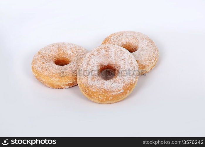 Three sugared donuts isolated on white background
