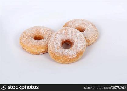 Three sugared donuts isolated on white background