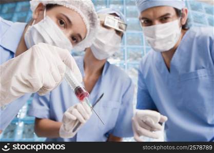 Three surgeons in an operating room