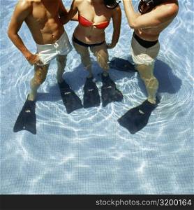 Three swimmers with flippers and snorkels in a swimming pool, La Concha Hotel, San Juan, Puerto Rico