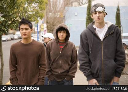 Three teenage boys walking