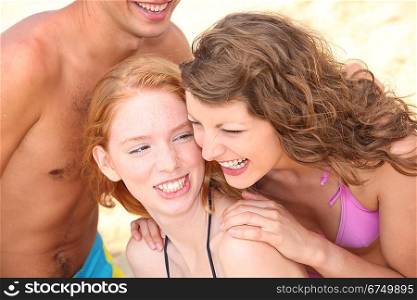 Three teenage friends at the beach