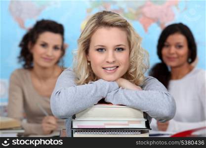 Three teenage girls in class room