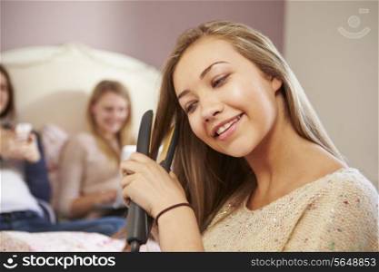 Three Teenage Girls Relaxing In Bedroom Together