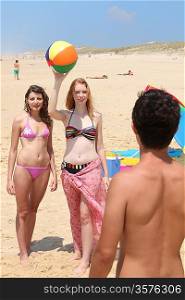 Three teenager at the beach