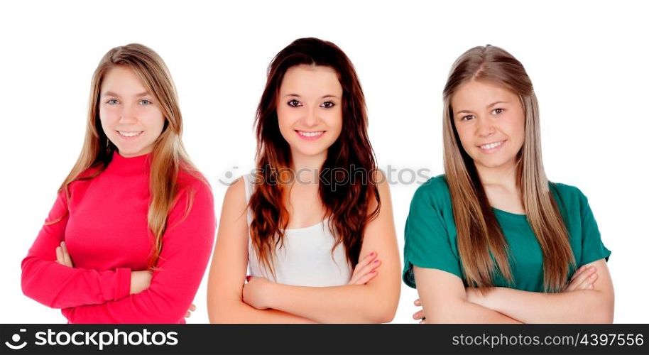 Three teenager girls with crossed arms isolated on a white background