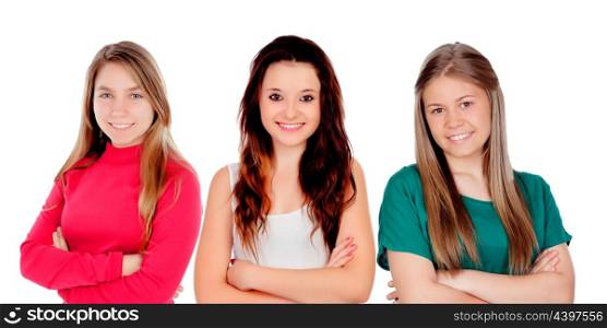 Three teenager girls with crossed arms isolated on a white background