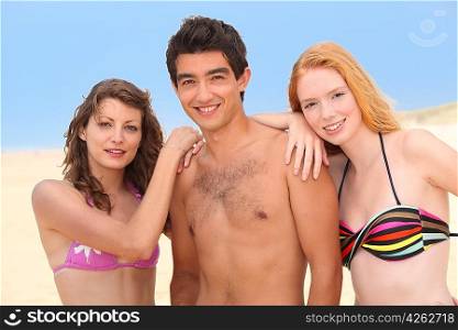 Three teenagers at the beach