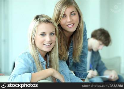 Three teenagers revising