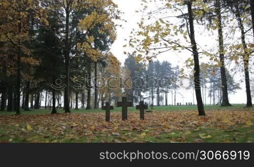 Three tombstone crosses. Cemetery of German soldiers in Toila, Estonia. Autumn.