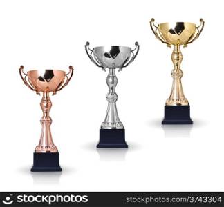 Three trophies, gold, silver and bronze. Isolated on white background