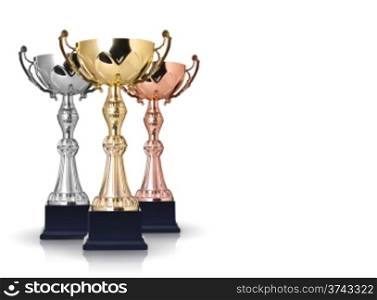 Three trophies, gold, silver and bronze on gray background