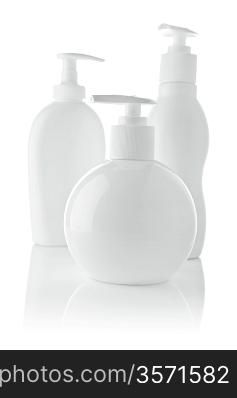 three white spray bottles