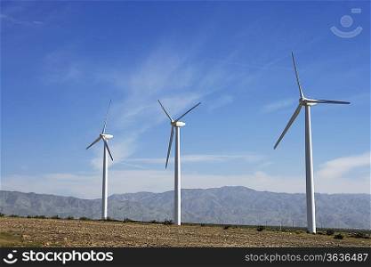 Three wind turbines in desert