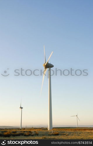 Three wind turbines on a Cornish wind farm, UK.