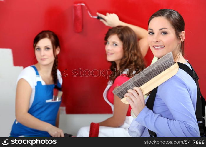 Three woman painting.