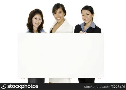 Three Women and Blank Sign