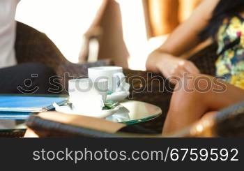 Three women enjoy a coffee break at outdoor cafe