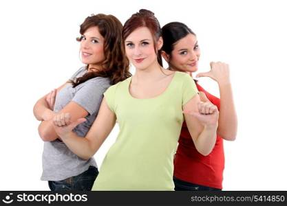 Three women giving the thumbs-up